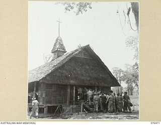 LAE, NEW GUINEA. 1944-09-29. SERVICE PERSONNEL MOVING INTO THE NEW CHAPEL AT HEADQUARTERS NEW GUINEA FORCE FOR THE CONSECRATION CEREMONY TO BE CONDUCTED BY VX13 LIEUTENANT-GENERAL S.G. SAVIGE, CB, ..