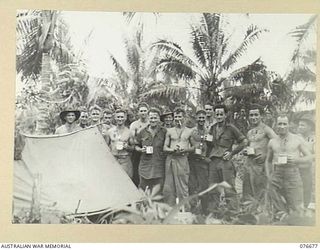 JACQUINOT BAY, NEW BRITAIN. 1944-11-04. PERSONNEL OF A COMPANY, 14/32ND INFANTRY BATTALION ENJOYING A MORNING TEA BREAK DURING THEIR JUNGLE CLEARING OPERATIONS FOR THE UNIT CAMP. IDENTIFIED ..