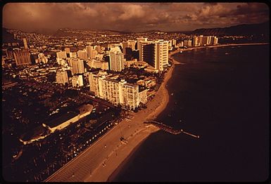 WAIKIKI BEACH AREA. WAIKIKI IS THE MOST POPULAR TOURIST SPOT ON THE ISLAND. IN 1963 THERE WERE 9,203 HOTEL ROOMS ON ALL OF OAHU. TEN YEARS LATER THE NUMBER IS 26,000 ROOMS, AND MOST ARE IN WAIKIKI