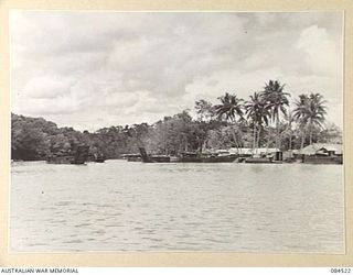 LABU, NEW GUINEA. 1944-12-18. 55 PORT CRAFT COMPANY SHORE INSTALLATIONS FROM A LAUNCH MID-STREAM IN THE MARKHAM RIVER