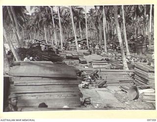 BUIN AREA, BOUGAINVILLE. 1945-09-28. THE CAMP AND EMBARKATION POINT WHERE JAPANESE TROOPS IN THE BUIN AREA AWAIT TRANSPORT TO FAURO ISLAND WHERE THEY WILL BE CONCENTRATED. THESE ARRANGEMENTS HAVE ..