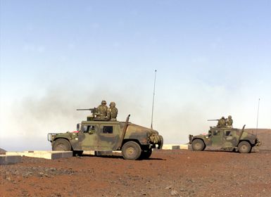 US Marines from 2nd Battalion, 3rd Marines, Weapons Company, aboard High-Mobility Multipurpose Wheeled Vehicles (HMMWV) fire 50 Caliber guns during a Combined Arms Live Fire Exercise at Pohakuloa Training Area on the Big Island of Hawaii