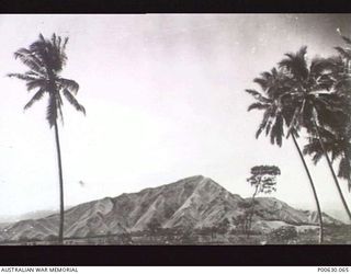 NADZAB, NEW GUINEA, C 1945. LOOKING ACROSS AT PROBABLY MT. NGARONENO WHICH HIDES A LARGE LAKE NEAR NADZAB (DONOR: MUSEUMS AND ART GALLERIES OF THE N.T.)