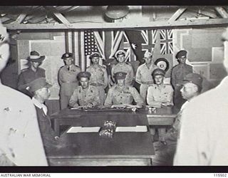 TOROKINA, BOUGAINVILLE. 1945-09-08. LIEUTENANT-GENERAL (LT-GEN) S. G. SAVIGE, GENERAL OFFICER COMMANDING 2 CORPS, ACCEPTED THE SURRENDER OF ALL JAPANESE FORCES ON BOUGAINVILLE FROM LT-GEN M. KANDA, ..