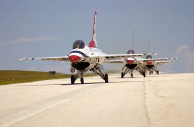 U.S. Air Force Thunderbirds Aerial Demonstration Team F-16C Fighting Falcon aircraft taxi after landing at Andersen Air Force Base, Guam, September 9, 2004. This landing marks the first time in a decade the USAF Thunderbird demonstration team has visited Guam. The Thunderbirds will be performing during an air show held Sunday, September 12, 2004. (U.S. Air Force PHOTO by STAFF SGT. Bennie J. Davis III) (Released)