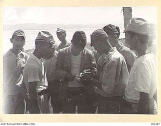 KAIRIRU ISLAND, NEW GUINEA, 1945-09-11. JAPANESE NAVAL PERSONNEL WHO ARE BEING TRANSFERRED FROM KAIRIRU TO MUSCHU ISLAND. FOLLOWING THE SURRENDER OF THE JAPANESE THE ISLANDS ARE NOW UNDER THE ..