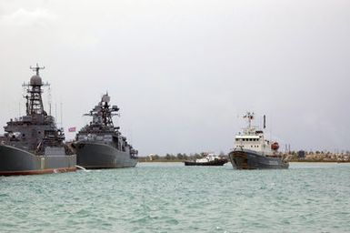 The Russian Federated Navy (RFN) GORYN (Type 714) Class, Salvage Tug, (ARS 522) (right), navigates through Apra Harbor, Guam (GU). Also pictured are the RFN Parchim II Class (Type 133.1m) Frigate, PARCHIM II (foreground left) and a RFN Sovremenny Class (Type 956), Destroyer (background left). A US Navy (USN) Harbor Tugboat operates background center. Four RFN Ships are participating with US Navy Ships in Passing Exercise 2006 (PASSEX 06) off the coast of Guam. PASSEX 06 is an exercise designed to increase interoperability between the two navies while enhancing the strong cooperative relationship between Russia and the United States