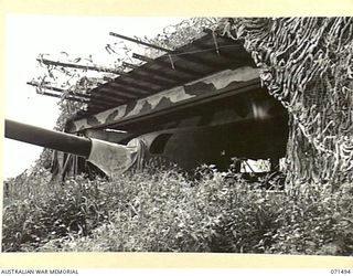 PORT MORESBY, PAPUA, NEW GUINEA. 1944-03-27. THE NO.2 GUN EMPLACEMENT HOUSING A 6 INCH GUN AT PAGA BATTERY, COAST ARTILLERY, AT THE MOUTH OF THE HARBOUR