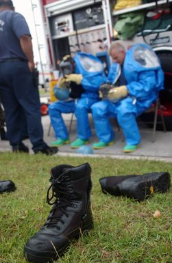 U.S. Air Force hazardous materials response team Airmen, from the 36th Civil Engineer Squadron, rests after responsing to a minor explosion in a warehouse at Andersen Air Force Base, Guam, on Jan. 12, 2005. (USAF PHOTO by TECH. SGT. Cecilio Ricardo) (Released)