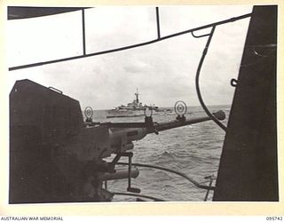 AT SEA OFF RABAUL, NEW BRITAIN. 1945-09-06. HMS HART APPROACHING THE AIRCRAFT CARRIER HMS GLORY WITH THE JAPANESE SURRENDER PARTY ABOARD. THE SURRENDER OF ALL JAPANESE FORCES IN NEW GUINEA, NEW ..