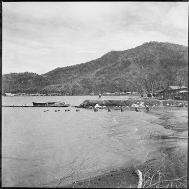 View across the harbour with buildings around the shoreline, Rabaul Harbour, New Guinea, ca. 1936 / Sarah Chinnery