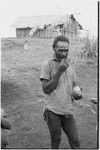 Yeria, Wanuma Census Division: man dips lime out of gourd for betel nut chewing