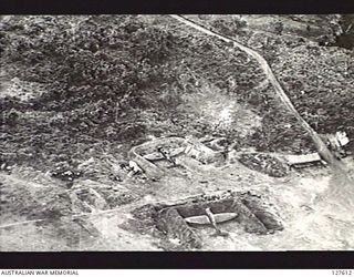 VUNAKANOU, NEW GUINEA. ? 1943-11. VIEW FROM FIFTH AIR FORCE, UNITED STATES ARMY AIR FORCE BOMBER, DISPERSED AIRCRAFT IN REVETMENT BAYS. IN PEACE TIME VUNAKANOU WAS A CIVIL AERODROME