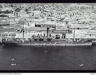 FREMANTLE, WA. AERIAL STARBOARD SIDE VIEW OF THE BRITISH CARGO VESSEL SARPEDON WHICH TRANSPORTED AUSTRALIAN TROOPS TO NEW GUINEA IN 1941-12. NOTE THE 4 INCH GUN AND 40 MM BOFORS AA GUN AFT. (NAVAL ..