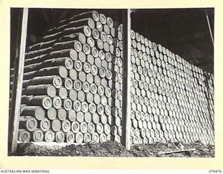 PALMALMAL PLANTATION, NEW BRITAIN. 1945-03-09. THOUSANDS OF DRUMS OF FLOUR STACKED IN ONE OF THE STOREHOUSES OF THE 31ST STORES DEPOT COMPANY