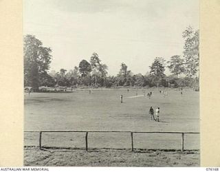 LAE, NEW GUINEA. 1944-09-02. THE UNIT FOOTBALL FIELD OF THE 22ND WORKS COMPANY, ROYAL AUSTRALIAN ENGINEERS. THE AREA, CLEARED OF HEAVY JUNGLE GROWTH BY OFFICERS OF THE UNIT, CONTAINS A CONCRETE ..