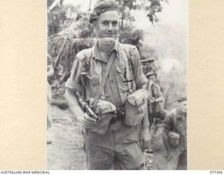 TOROKINA AREA, BOUGAINVILLE ISLAND. 1944-11-29. VX115580 LIEUTENANT J. DEACON, COMMANDER, NO.18 PLATOON, D COMPANY, 9TH INFANTRY BATTALION, WHO IS LEADING HIS PLATOON ON AN ATTACK ON THE JAPANESE ..