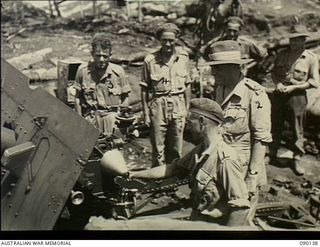 North Bougainville, Solomon Islands. 1945-03-31. Lord Wakehurst, Governor of New South Wales, visiting a twenty five pounder gun position of the 4th Field Regiment, 11th Australian Infantry ..