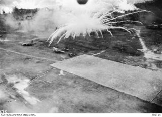 Rabaul, New Britain. 1943-11-02. Attack on Japanese planes on an airfield near Rabaul by B25 Mitchell bomber aircraft supported by P38 Lightnings of the US Fifth Air Force