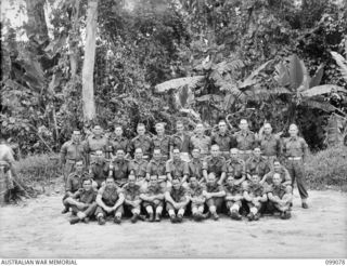 Group portrait of personnel of 244 Supply Depot Platoon. Identified left to right are: back row: VX109555 Driver (Dvr) John Samson; N24483 Dvr Albert Millen; VX88037 Corporal (Cpl) John Bourke; ..