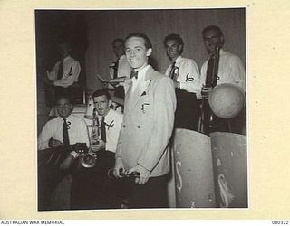 LAE, NEW GUINEA. 1944-07-25. HORRIE DARGIE WITH HIS SWING BAND DURING THE 3RD ARMOURED DIVISION CONCERT PARTY, AUSTRALIAN ARMY AMENITIES SERVICE PRODUCTION OF "SHELLS-A-POPPIN". IDENTIFIED ..