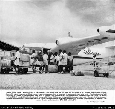 Loading freight aboard a Piaggio aircraft at Port Moresby