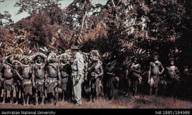Large group of Papua New Guineans in traditional clothing with official