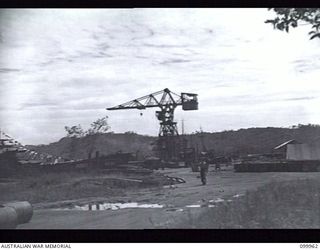 RABAUL, NEW BRITAIN, 1946-04-04. RECONDITIONED CRANE AT NAVAL HQ. AT PRESENT IT IS USED FOR WORK ON SMALL SHIPS, BUT WILL BE USED FOR HEAVY SHIPPING AS SOON AS THIS PORTION OF THE HARBOUR IS ..