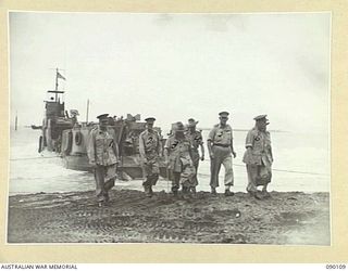 AITAPE, NEW GUINEA. 1945-03-20. GENERAL SIR THOMAS A. BLAMEY, COMMANDER-IN-CHIEF, ALLIED LAND FORCES, SOUTH WEST PACIFIC AREA (3), LIEUTENANT-COLONEL J.T. LANG, COMMANDER 3 BASE SUB-AREA (5), AND ..