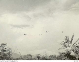 NADZAB, NEW GUINEA. 1944-09-02. A UNITED STATES ARMY AIR FORCE C-54 DOUGLAS FOUR ENGINED SKYMASTER TRANSPORT AIRCRAFT TOWING GLIDERS