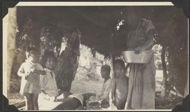 Portrait of village women and children, Samoa, 1929 / C.M. Yonge