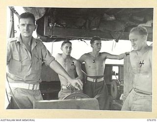 LAE, NEW GUINEA. 1944-10-03. THE CREW OF THE AUSTRALIAN LANDING CRAFT, AB1179, 43RD LANDING CRAFT COMPANY. IDENTIFIED PERSONNEL ARE:- NX166613 SAPPER JU.R. MOFFET, SKIPER (1); NX192782 SAPPER H.R. ..