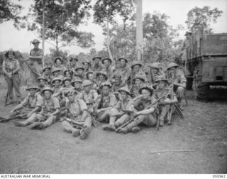 Donadabu, New Guinea. 1943-07-26. The men of No 7 Platoon, A Company, 61st Battalion, before the start of a supply dropping exercise. Left to right: front row, Privates N. Quine, Dwyer, L. Crowe; ..