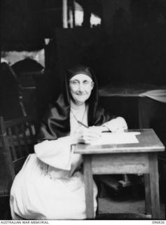 Ramale Mission, Kokopo Area, New Britain. Sister Mary F Borgia, Order of the Lady of the Sacred Heart, writing her first letter home in three and a half years. She celebrated her golden gubilee as ..