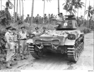 BLANCHE BAY, NEW BRITAIN. 1945-09-28. LIEUTENANT GENERAL J. NORTHCOTT, CHIEF OF GENERAL STAFF (1) INSPECTING A JAPANESE TYPE 97 CHI-HA MEDIUM TANK MANNED BY AUSTRALIANS OF 2/4 ARMOURED REGIMENT ..
