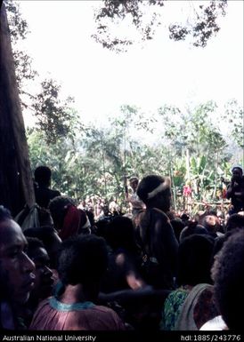 Man talking to gathered crowd