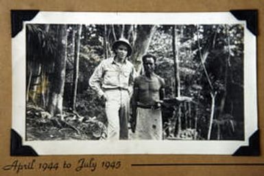 87-year-old Benny hensen (cq) poses for a portrait in 944 with a Papua New Guinea native when he worked as a Topographic specialist in the army during WWII. Hensen is an rockies fan who is in hospice care at the Atria Inn at Lakewood. He has played baseb