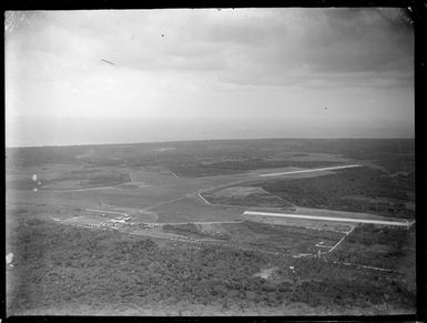 Aerial view of Fua'Amotu Airfield with runways surrounded by bush, Tonga