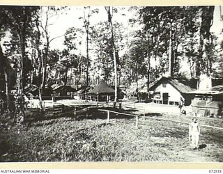 TOROKINA, BOUGAINVILLE, SOLOMON ISLAND, 1945-09-19. THE CAMP SITE AT U HEAVY BATTERY, ROYAL AUSTRALIAN ARTILLERY SHOWING (FROM THE RIGHT), THE KITCHEN, THE BATTERY Q STORE AND TENTS