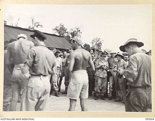 PALMALMAL, NEW BRITAIN. 1945-08-18. GRACIE FIELDS VISITED 2/8 GENERAL HOSPITAL DURING HER TOUR. SHOWN ARE NEW ZEALAND AND AUSTRALIAN TROOPS GETTING AUTOGRAPHS AT THE AIRSTRIP