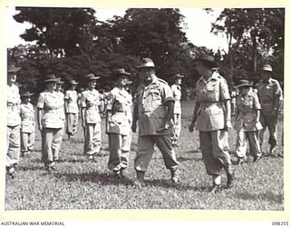 LAE, NEW GUINEA. 1945-10-25. GENERAL SIR THOMAS A. BLAMEY, COMMANDER-IN-CHIEF, ALLIED LAND FORCES, SOUTH WEST PACIFIC AREA, ACCOMPANIED BY CAPTAIN AMESBERY, INSPECTING AUSTRALIAN WOMEN'S ARMY ..