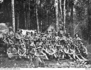 Group portrait of 9 Platoon, A Company, 2/14th Infantry Battalion on the Kokoda Trail.  Identified, left to right, back row: L A Bear; VX15468 Warrant Acting Officer Class 2 John Alexander Lochhead ..