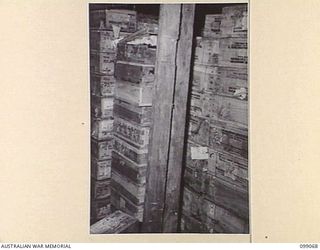 RABAUL, NEW BRITAIN. 1945-11-25. STACKS OF JAPANESE AMMUNITION, INCLUDING A CAPTURED WINCHESTER 303, STORED IN A TUNNEL IN 11 DIVISION AREA. THE JAPANESE MADE EXTENSIVE USE OF TUNNEL SYSTEMS AS A ..