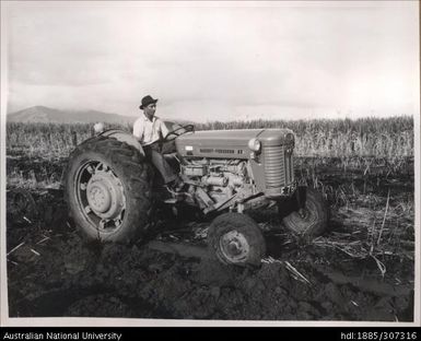 Farmer riding a tractor