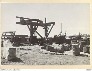 JACQUINOT BAY, NEW BRITAIN. 1945-06-09. THE BARGE REPAIR YARDS AND HOIST FOR 53 PORT CRAFT COMPANY, ROYAL AUSTRALIAN ENGINEERS, AT 5 BASE SUB-AREA