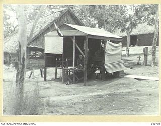 Port Moresby. 1944-03. An electric message conveyor designed to carry messages between Signal Office, 18th Australian Lines of Communication Signals and Headquarters, New Guinea Force. Messages in ..