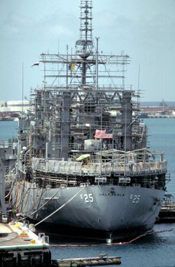 Scaffolding covers the superstructure of the USS HALEAKALA (AE-25) as the ammunition ship undergoes repair