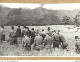 RAMU VALLEY, NEW GUINEA. 1943-10-20. CHURCH OF ENGLAND PARADE AT HEADQUARTERS, 21ST AUSTRALIAN INFANTRY BRIGADE, CONDUCTED BY SX11061 PADRE H. NORMAN, OF 2/27TH AUSTRALIAN INFANTRY BATTALION