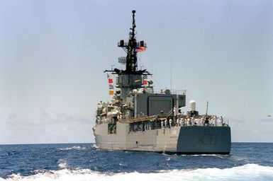 The USS BREWTON (FF 1086) departs from Pearl Harbor at the conclusion of the designation and departure ceremony for the Unknown Serviceman of the Vietnam Era. The frigate is transporting the Unknown to Naval Air Station Alameda, California