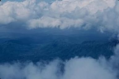 [Aerial view of South Pacific forested hills]